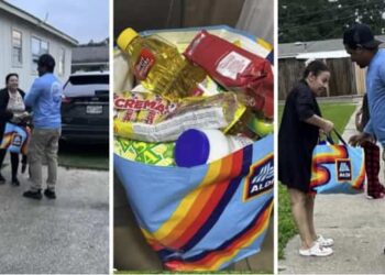 Hondureños entregan comida a migrantes