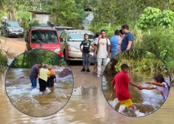 Cruzando entre el agua para no quedar aislados: El drama de miles de pobladores tras la crecida del Lago de Yojoa