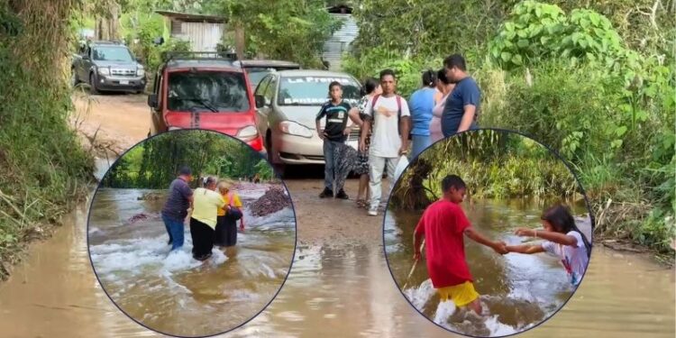 Cruzando entre el agua para no quedar aislados: El drama de miles de pobladores tras la crecida del Lago de Yojoa